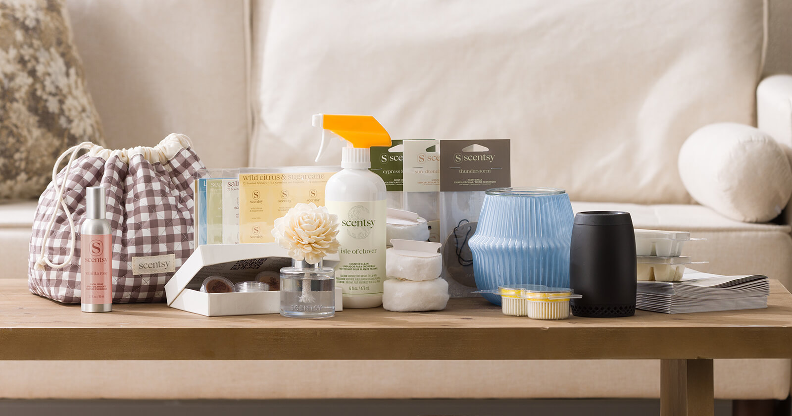 Scentsy Signature Starter Kit — warmer, bars, diffuser, and catalogs arranged on a warm neutral surface